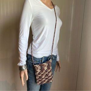 Handcrafted crossbody bag.